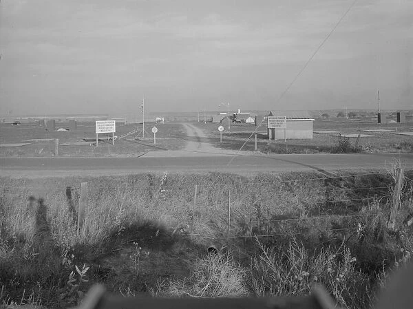 Entrance to Nyssa Farm family labor camp, FSA mobile unit... 1, Near Nyssa, Oregon, 1939. Creator: Dorothea Lange