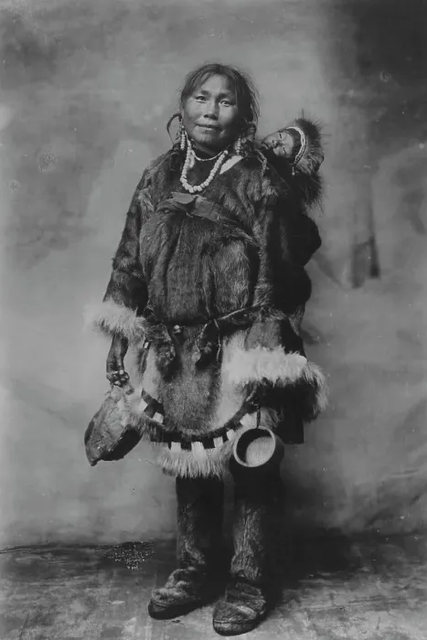 Framed Print : Eskimo mother carrying a child on her back, 1916(?). Creator: Unknown Framed Print : Eskimo mother carrying a child on her back, 1916(?). Creator: Unknown