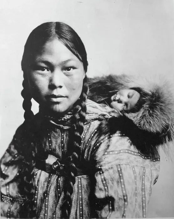 Framed Print : Eskimo mother with child on back, c1906. Creator: Lomen Brothers Framed Print : Eskimo mother with child on back, c1906. Creator: Lomen Brothers