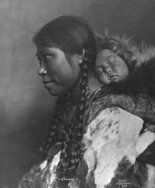 Eskimo mother and child , c1905, printed (1923?). Creator: Lomen Brothers