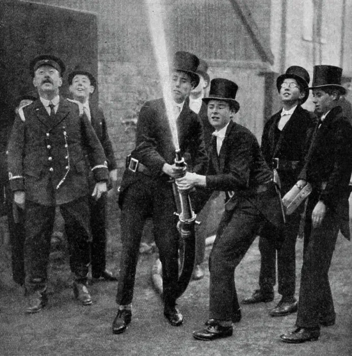 Framed Print : Etons amateur firemen practising a hose drill, Berkshire, c1922 Framed Print : Etons amateur firemen practising a hose drill, Berkshire, c1922