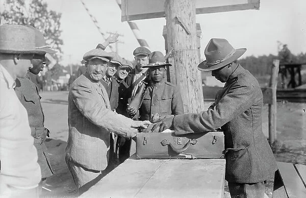 Examining pkges, Camp Upton, Sept 1917. Creator: Bain News Service