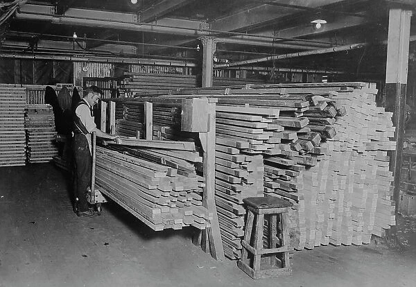 Examining spruce for planes, between c1915 and c1920. Creator: Bain News Service