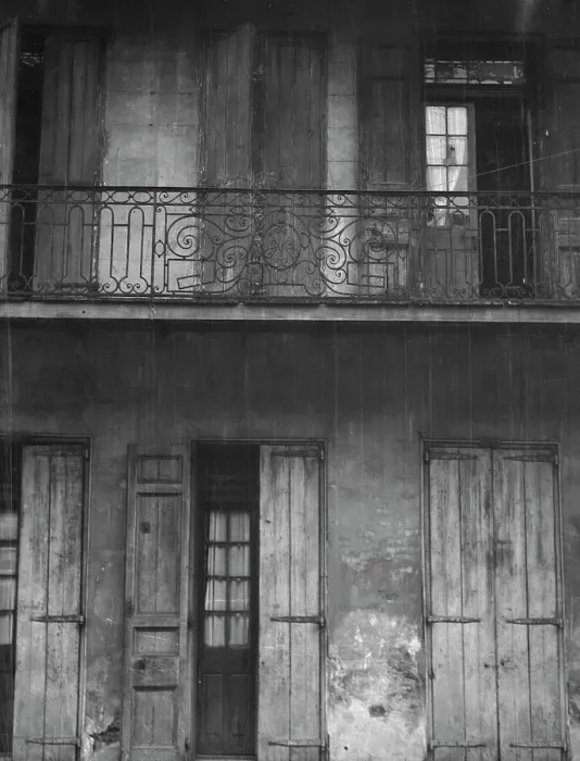 Framed Print : Facade of a building with shuttered doors and balcony, New Orleans or Charleston... c1920-1926. Creator: Arnold Genthe Framed Print : Facade of a building with shuttered doors and balcony, New Orleans or Charleston... c1920-1926. Creator: Arnold Genthe