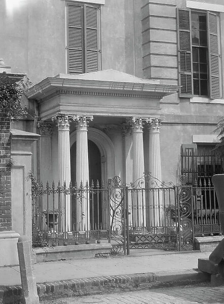 Facade of a multi-story house, New Orleans or Charleston, South Carolina, between 1920 and 1926. Creator: Arnold Genthe