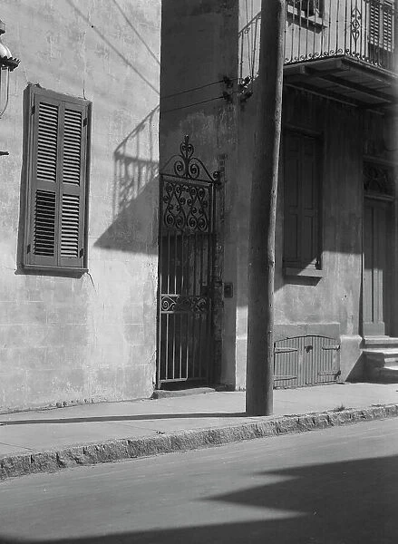 Facades of multi-story houses, New Orleans or Charleston, South Carolina, between 1920 and 1926. Creator: Arnold Genthe
