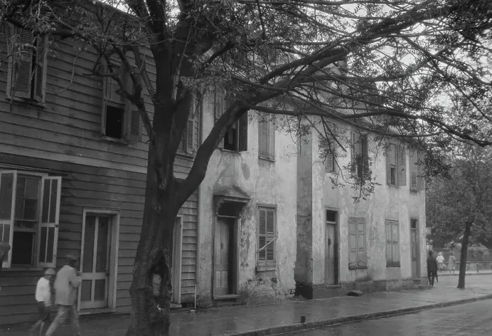 Framed Print : Facades of two-story houses, [Alexander Peronneau Tenements, 141 Church Street... c1920-1926. Creator: Arnold Genthe Framed Print : Facades of two-story houses, [Alexander Peronneau Tenements, 141 Church Street... c1920-1926. Creator: Arnold Genthe