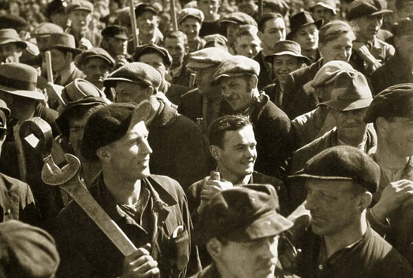 Factory workers with their tools celebrate the traditional Socialist holiday, Germany, 1936