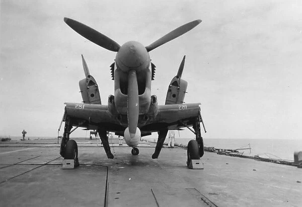 Fairey Firefly aircraft ready to be transported to the hangar lift, HMS Venerable, 1945
