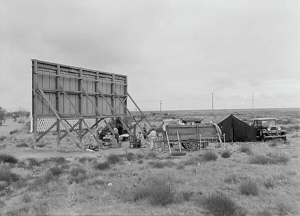 Three families camped on the plains along US99 in California, 1938. Creator: Dorothea Lange