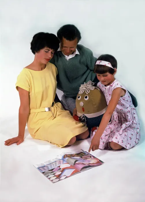 Framed Print : Family group looking at a magazine, 1963. Artist: Michael Walters Framed Print : Family group looking at a magazine, 1963. Artist: Michael Walters