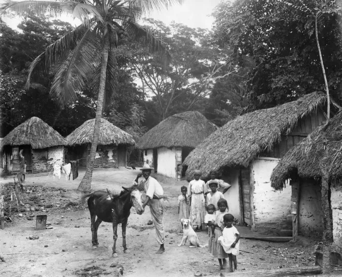 Framed Print : Family outside their home, Coolie Street, Kingston, Jamaica, 1931 Framed Print : Family outside their home, Coolie Street, Kingston, Jamaica, 1931