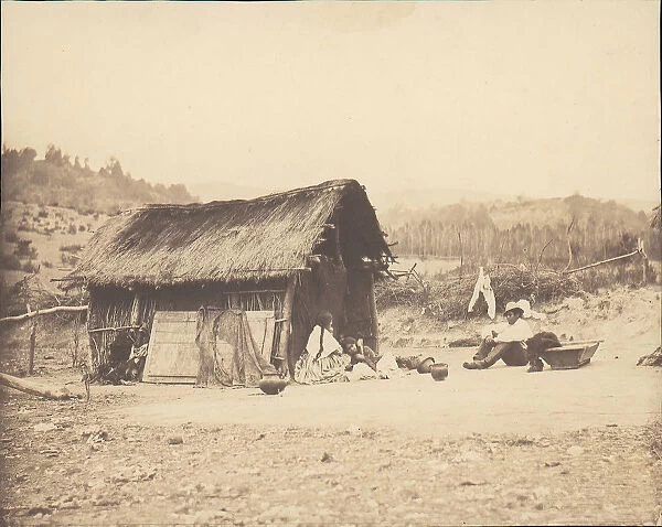 Family Seated by Thatched Hut, South America, 1850s. Creator: Unknown