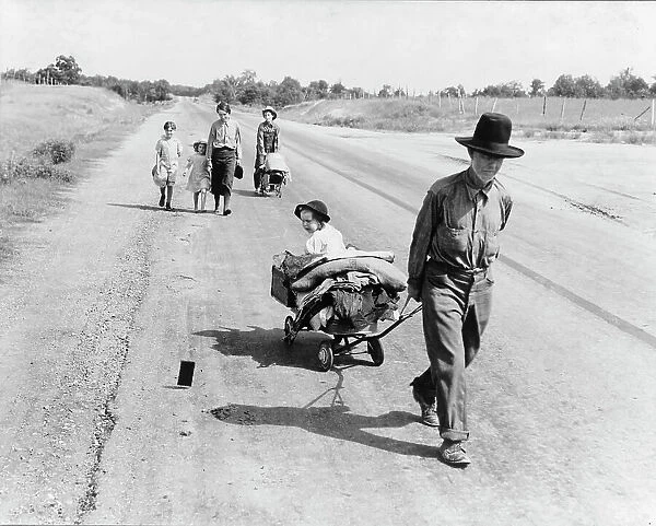 Family walking on highway, five children, Pittsburg County, Oklahoma, 1938. Creator: Dorothea Lange