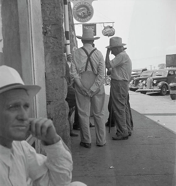 Farmers on main street discussing drought, Sallisaw, Sequoyah County, Oklahoma, 1936. Creator: Dorothea Lange