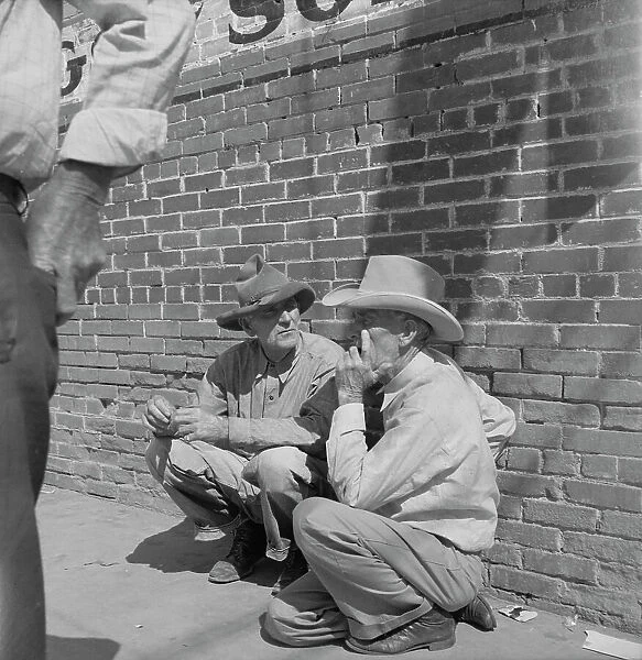 Farmers on street corner, Odessa, Texas, 1937. Creator: Dorothea Lange
