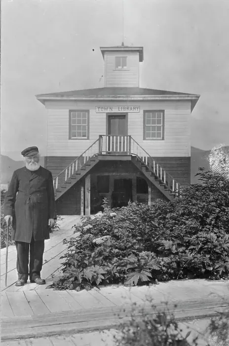 Framed Print : Father William Duncan, a missionary, in front of town library, between c1900 and 1923. Creator: Unknown Framed Print : Father William Duncan, a missionary, in front of town library, between c1900 and 1923. Creator: Unknown