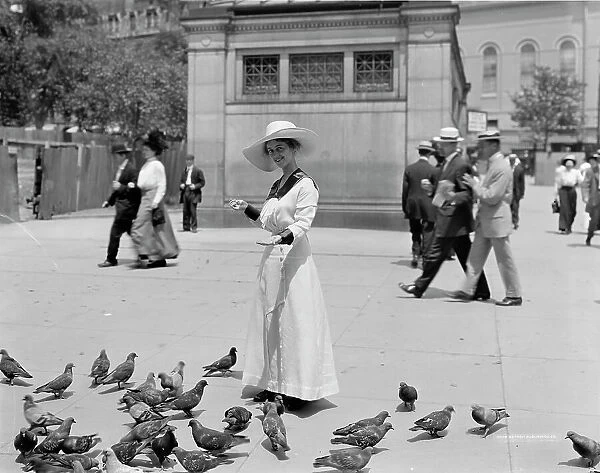 Feeding the pigeons, Boston Common, possibly 1911 or 1912. Creator: William H. Jackson