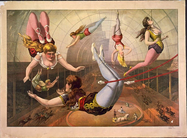Female acrobats on trapezes at circus, c. 1890. Artist: Calvert Litho. Co