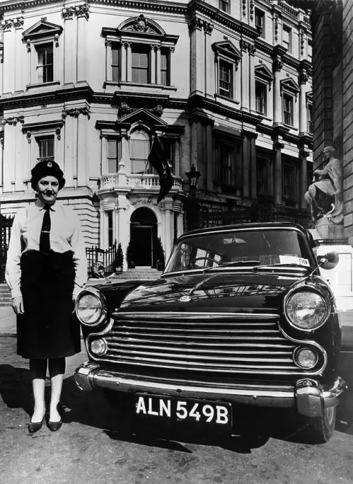 Framed Print : Female chauffeur standing by a 1964 Morris Oxford, 1964 Framed Print : Female chauffeur standing by a 1964 Morris Oxford, 1964