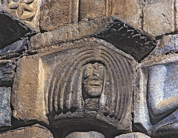 Female Head, capital of the facade of the church of San Luis de Alos d Aneu
