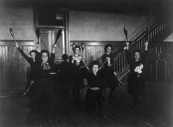 Female students exercising with bowling pins, Western High School, Washington, D.C. (1899?). Creator: Frances Benjamin Johnston
