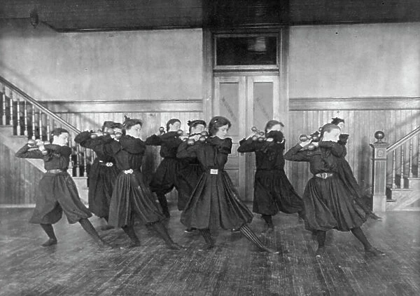 Female students exercising with dumbbells, Western High School, Washington, D.C. (1899?). Creator: Frances Benjamin Johnston