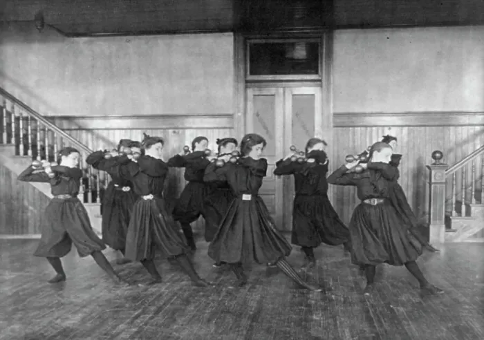 Framed Print : Female students exercising with dumbbells, Western High School, Washington, D.C. (1899?). Creator: Frances Benjamin Johnston Framed Print : Female students exercising with dumbbells, Western High School, Washington, D.C. (1899?). Creator: Frances Benjamin Johnston