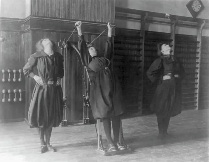 Framed Print : Female students exercising, one with a wall-mounted device using ropes... Washington, D.C. (1899?) Creator: Frances Benjamin Johnston Framed Print : Female students exercising, one with a wall-mounted device using ropes... Washington, D.C. (1899?) Creator: Frances Benjamin Johnston