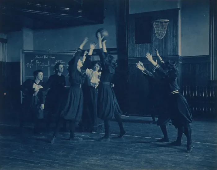 Framed Print : Female students playing basketball in a gymnasium, Western High School, Washington, D.C. (1899?). Creator: Frances Benjamin Johnston Framed Print : Female students playing basketball in a gymnasium, Western High School, Washington, D.C. (1899?). Creator: Frances Benjamin Johnston