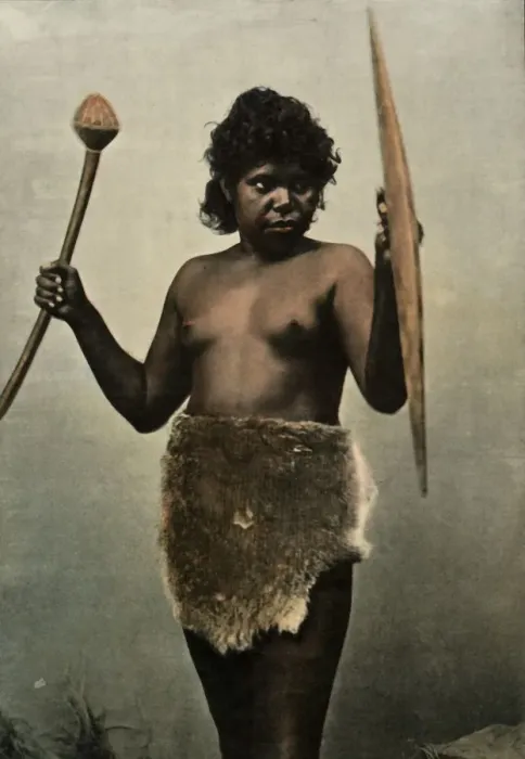 Framed Print : Femme Australienne Chargee Des Armes De Son Mari, (Austrailan Woman with Husbands Weapons), 1900 Framed Print : Femme Australienne Chargee Des Armes De Son Mari, (Austrailan Woman with Husbands Weapons), 1900