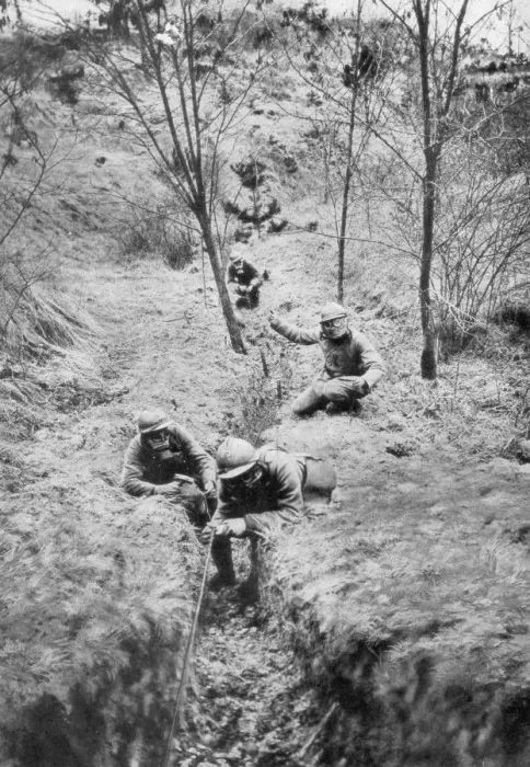 Framed Print : Fench sappers in gas masks re-laying telephone lines after a bombardment, 1918 Framed Print : Fench sappers in gas masks re-laying telephone lines after a bombardment, 1918