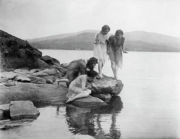 Four figures at water edge, c1914. Creator: Frances Benjamin Johnston