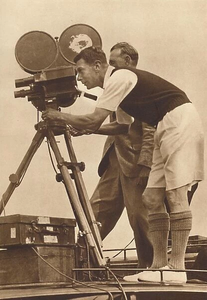 Film-maker - Making a cinema record at one of his annual camps for boys, 1927 (1937)