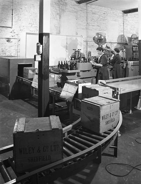 The final stages of bottling whisky at Wiley & Co, Sheffield, South Yorkshire, 1960
