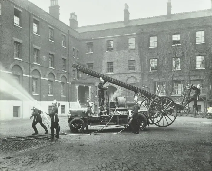 Framed Print : Fireman using a hose, London Fire Brigade Headquarters, London, 1910 Framed Print : Fireman using a hose, London Fire Brigade Headquarters, London, 1910