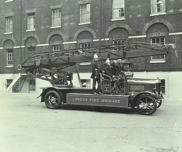 Firemen aboard a fire engine, London Fire Brigade Headquarters, London, 1929