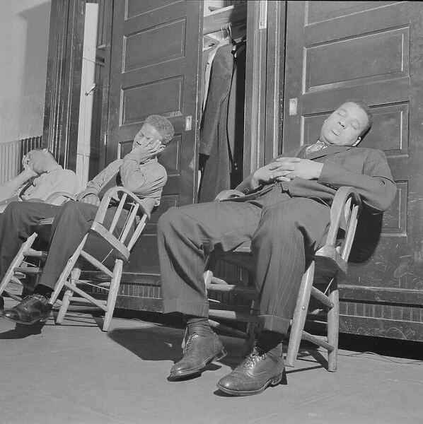 Firemen taking a nap in engine house number four, Washington, D. C, 1943. Creator: Gordon Parks