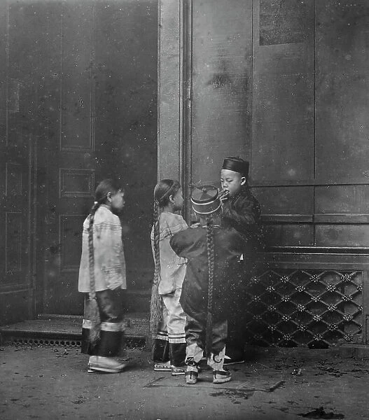His first cigar, Chinatown, San Francisco, between 1896 and 1906. Creator: Arnold Genthe