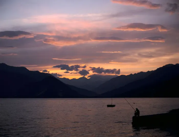 Framed Print : Fisherman at sunset, Lake Maggiore, Italy Framed Print : Fisherman at sunset, Lake Maggiore, Italy