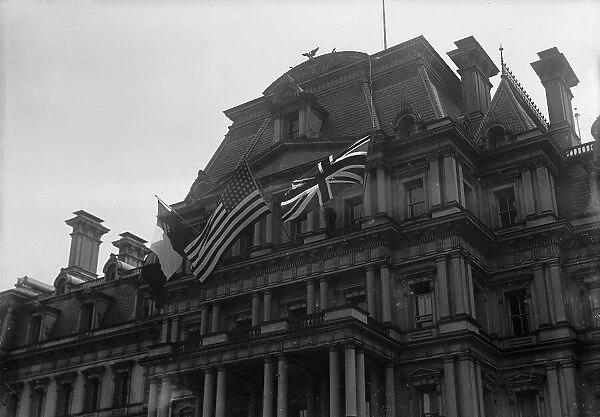 Flags - American, British, And French Flags On State Department. Visit of Allied Commission, 1917. Creator: Harris & Ewing. Flags - American, British, And French Flags On State Department. Visit of Allied Commission, 1917