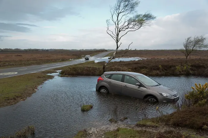 Framed Print : Ford Focus in flooded ditch after losing control on wet road 2012 Framed Print : Ford Focus in flooded ditch after losing control on wet road 2012