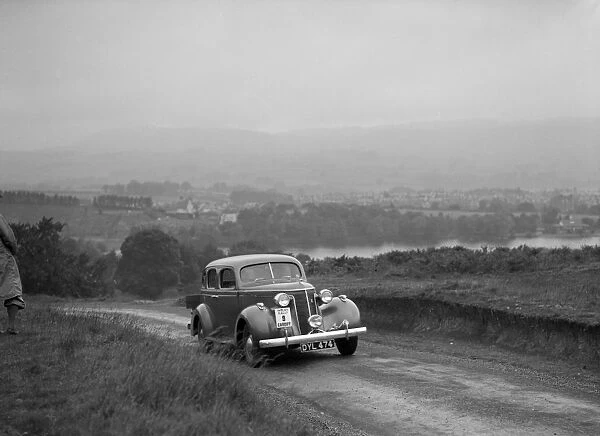 Ford V8 saloon competing in the South Wales Auto Club Welsh Rally, 1937 Artist: Bill Brunell