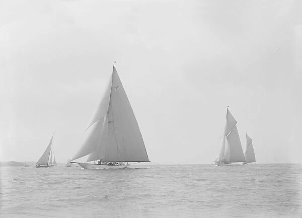 In the foreground the 23-metre cutter Astra sailing on a reach