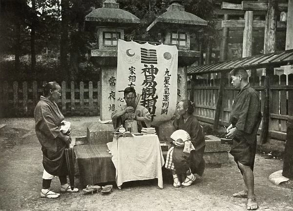A Fortune-Teller at Inari Temple, 1910. Creator: Herbert Ponting