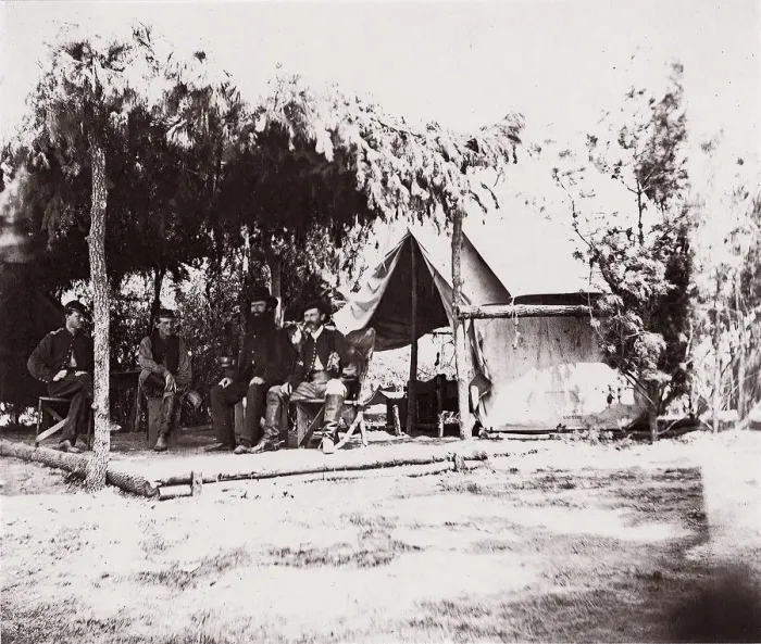 Framed Print : [Four men in camp under a lean-to of pine boughs], 1861-65. Creator: Unknown