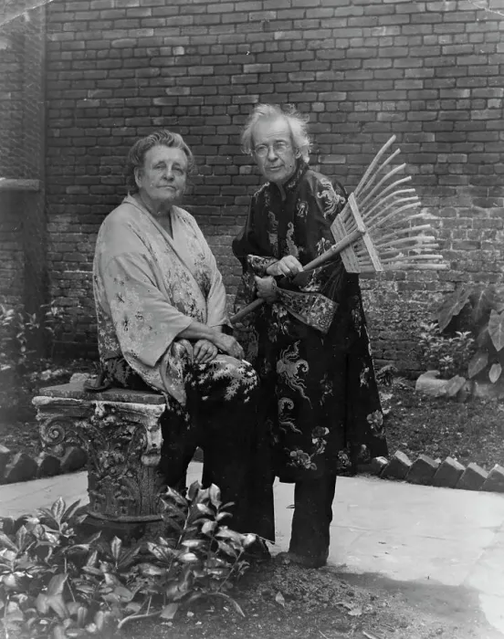 Framed Print : Frances B. Johnston in garden in New Orleans with Pops Whitesell, who is holding... c1945 - 1952. Creator: Frances Benjamin Johnston. Frances B. Johnston in garden in New Orleans with Pops Whitesell, who is holding... c1945 - 1952 Framed Print : Frances B. Johnston in garden in New Orleans with Pops Whitesell, who is holding... c1945 - 1952. Creator: Frances Benjamin Johnston. Frances B. Johnston in garden in New Orleans with Pops Whitesell, who is holding... c1945 - 1952
