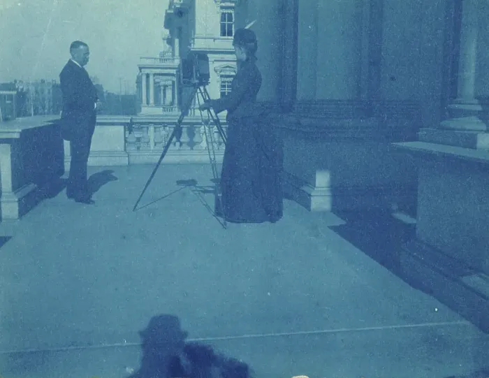 Framed Print : Frances Benjamin Johnston on a balcony of the State, War and Navy Building with a tripod... 1888. Creator: Frances Benjamin Johnston Framed Print : Frances Benjamin Johnston on a balcony of the State, War and Navy Building with a tripod... 1888. Creator: Frances Benjamin Johnston