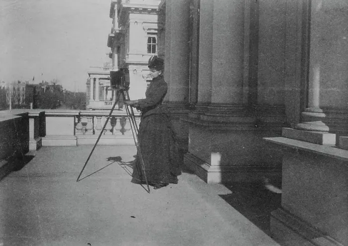Framed Print : Frances Benjamin Johnston with camera on balcony of State, War and Navy Building... 1888. Creator: Frances Benjamin Johnston Framed Print : Frances Benjamin Johnston with camera on balcony of State, War and Navy Building... 1888. Creator: Frances Benjamin Johnston