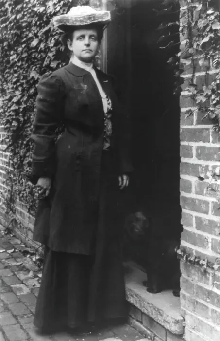 Framed Print : Frances Benjamin Johnston, in doorway with cocker spaniel, n.d.. Creator: Frances Benjamin Johnston